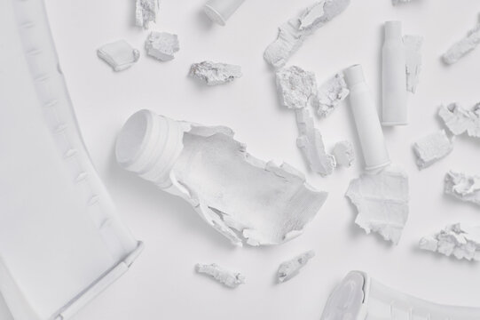 Damaged white objects and ammunition debris close-up