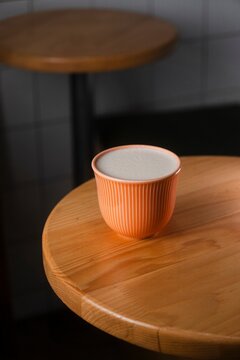 Warm Raf Coffee in Orange Cup