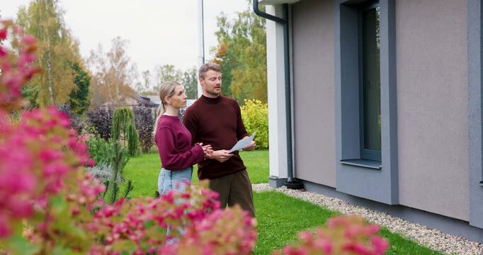 Real estate agent showing modern house to client. Realtor and customer inspecting property before buying