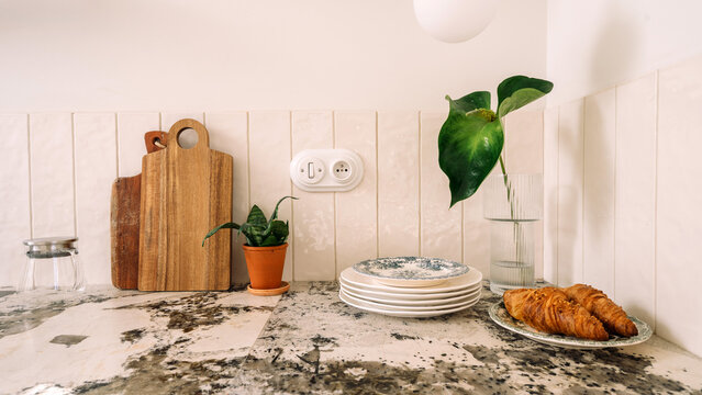 Modern kitchen interior with marble countertop and decorative elements