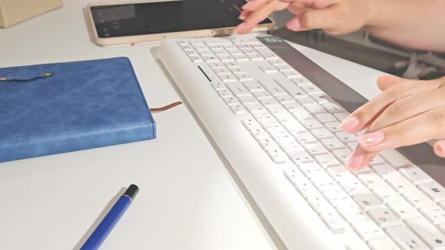 Typing on White Keyboard in Office