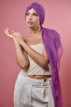 Young woman with powerful stance in breast cancer awareness campaign