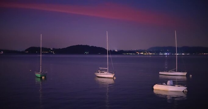 Multicolored dawn on the port of Lesa