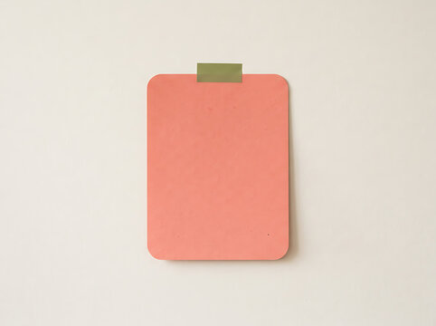 Pink paper note attached with olive green tape