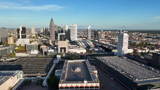 Aerial view of Messe Frankfurt exhibition center with modern skyscrapers and urban infrastructure in Frankfurt am Main, Hessen, Germany.