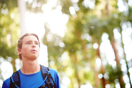Nature, man and exercise with running for fitness, breathing and runner with training for marathon. Outdoor, male person and athlete with drinking tube for wellness, endurance and cardio for workout