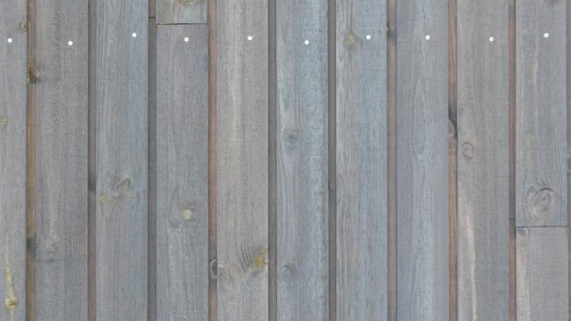 Weathered gray wooden fence texture