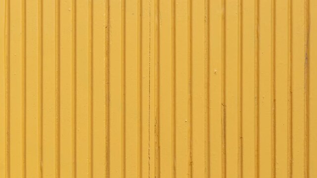 Yellow corrugated metal panel texture
