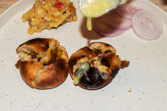 Litti with drops of ghee, selective focus