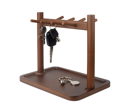 Wooden key holder rack with hooks and tray isolated on white background