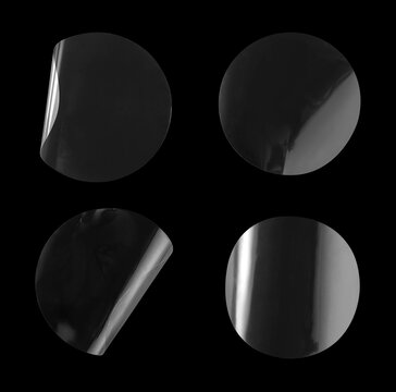 Transparent round adhesive sticker mockup set with peeling peeled edges isolated on black background with clipping path