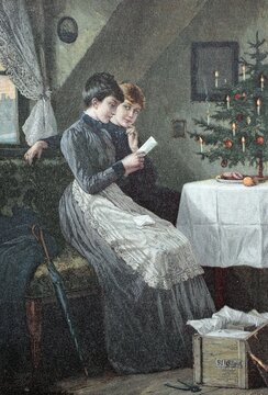 Christmas Eve in the attic, two women reading a letter in front of a Christmas tree, Germany, Historic, digitally restored reproduction of a 19th century original