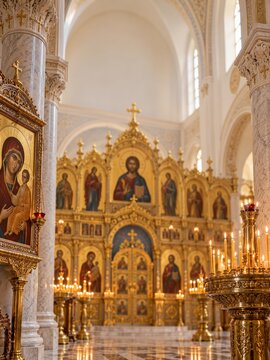 Golden Iconostasis beneath Bright Vaults in a Marble Church Interior