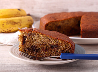 Slice of banana and chocolate cake on plate © manyakotic