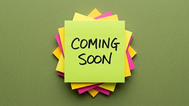 Bright sticky notes stack with coming soon announcement on top with displays message indicating indicating upcoming event colorful sticky event release communication notification handwritten with post