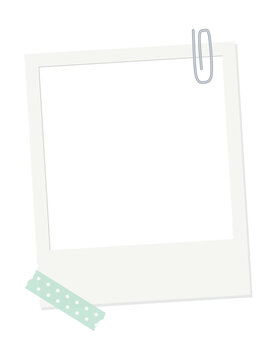 Blank instant photo frame with paper clip and polka dot washi tape on white background, scrapbook memory frame with copy space
