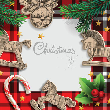 Christmas rocking horse ornaments and candy cane on red plaid background with copy space for holiday greeting
