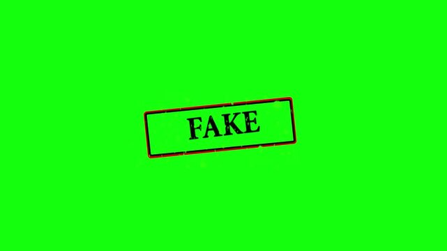 FAKE stamp animation on green background for counterfeit,scam alerts and authenticity warning concepts. 4k