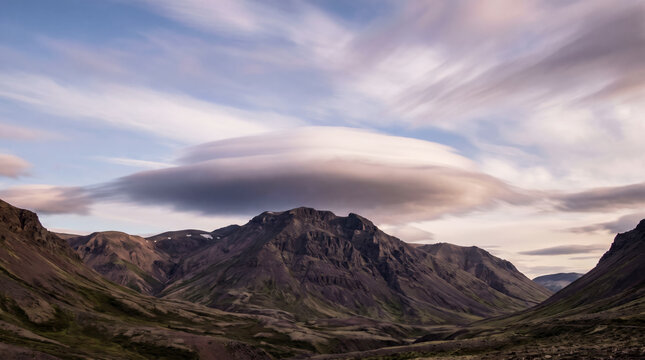 Mysterious Stationary Cloud Above Rugged Mountain Valley