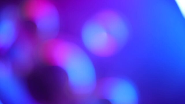 Abstract vibrant colorful bokeh lights background motion blur effect