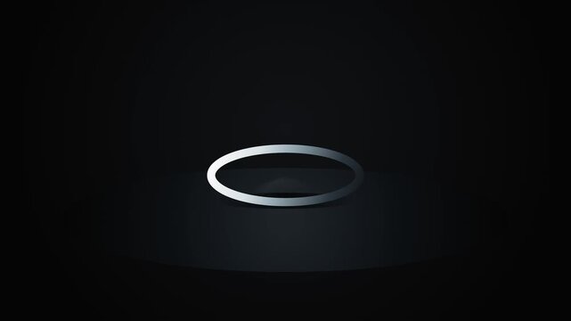 Abstract metallic ring spinning and shrinking in dark environment with spotlight effect