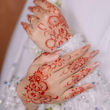 Close Up of Traditional Bridal Henna Design on Hands