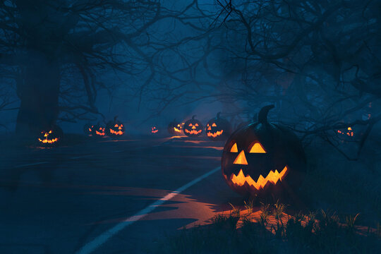 Spooky Halloween road at night with glowing Jack-o'-lanterns leading into a misty forest of bare branches. One large, carved pumpkin is on the foreground right. Eerie and mysterious.