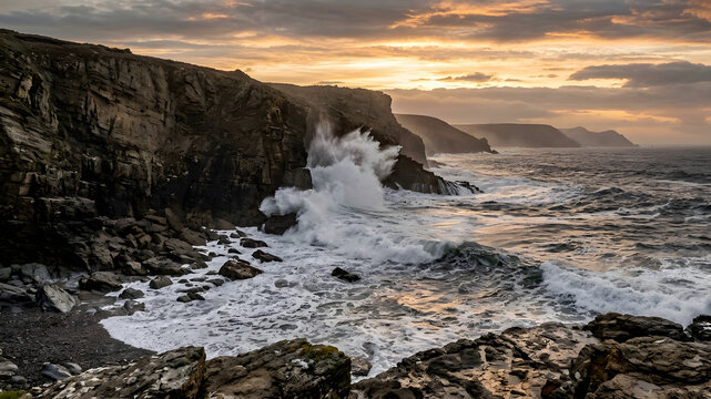 Rugged coast with waves crashing against cliffs under dramatic sky lit by sunset