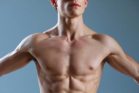 Male torso shifting freely in soft daylight pastel sky blue background athletic build bare chest defined muscle healthy skin serene mood fitness concept