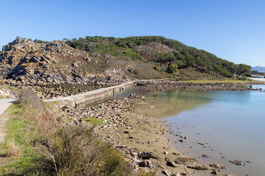 cies islands stone walkway at the lake in natural park of galicia spain