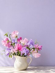 Fototapeta premium Pink and purple sweet peas in a glazed cream pitcher with copy space