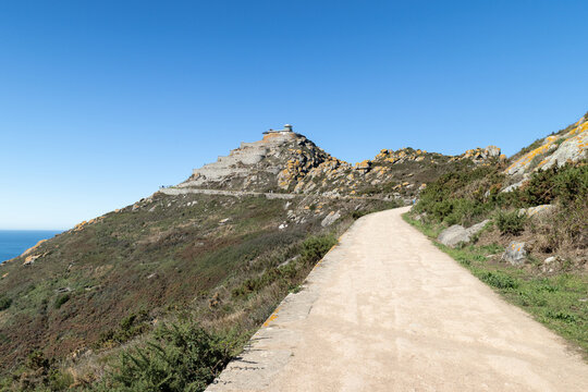 Path leading to the lighthouse at Cies Islands natural park in Galicia Spain