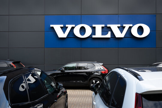 Volvo car dealership with cars parked in front