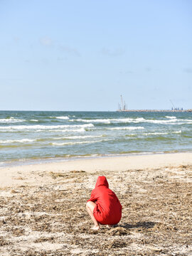 A Woman Searching the Beach for Amber in Nida, Lithuania