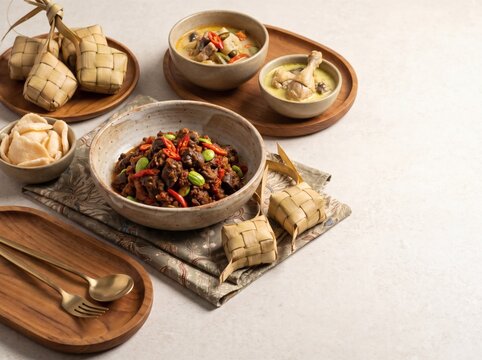 Indonesian Lebaran feast with ketupat rendang and sambal dishes