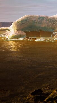 An iceberg is seen floating in calm water as the sun sets in the background. The colors change as the sun fades, highlighting the natural beauty of the scene.