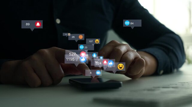 Man using smart phone with emoticon icons of Social Media.Interactive with friends on chat with emoticon feedback.Social media,marketing, like,social network,blog,live,chat reaction and livestream.	
