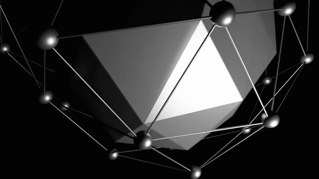 Abstract rotating polyhedron with metallic sphere structure display