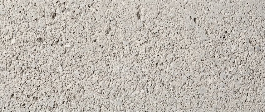 Sponge finish concrete texture background. Detailed overhead view of rough porous cement stucco wall surface