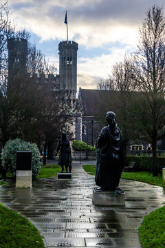 Early morning view of the bronze statues of King Ethelbert and Queen Bertha in front of Fyndon gate, the medieval remains of the gate to St Augustene Abbey in Canterbury.