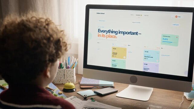 Caucasian teenager browsing online tutoring platform on desktop computer. Visual suited for educational technology advertising, remote learning campaigns, and digital homeschooling promotions