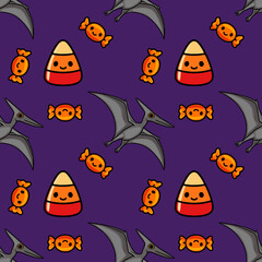 Seamless vector pattern with cute cartoon pterodactyls, candy corn, and orange wrapped candies on a purple background for Halloween © Khrystyna Turchyn