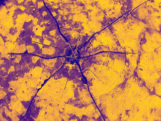 Top-down macro view of an abstract wooden surface featuring natural radial cracks radiating from the center, presented in a striking yellow and purple duotone color scheme.  © Dihan