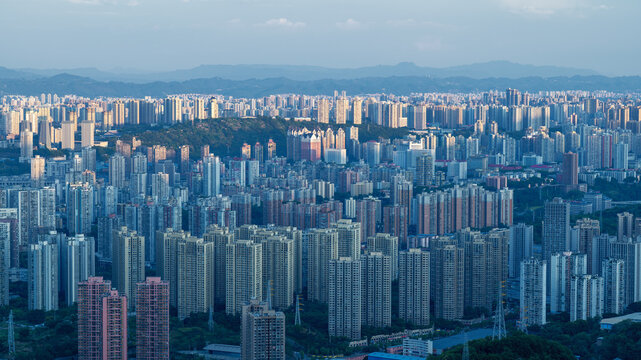 Aerial View of Chongqing City Skyline with Dense High-Rise Buildings and Mountains