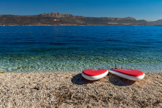 Two stand up paddleboards on Liveli Beach on Ciovo Island, Croatia