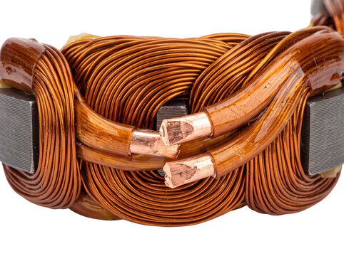 Copper wire coil electric motor stator winding close up showing exposed copper core and glossy insulated electrical windings on black background for industrial engineering, power generation technology