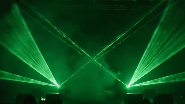 Dynamic green laser show and stage lighting effects with haze and smoke for concerts and electronic music events