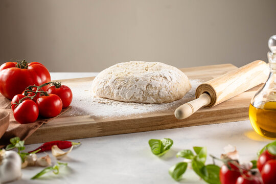 Dough preparation recipe bread, pizza or pie making ingridients, food flat lay on kitchen table background.