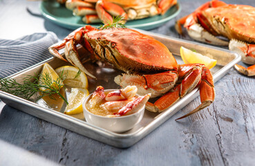 Platter of King Crabs with Butter and Lemon © Maria