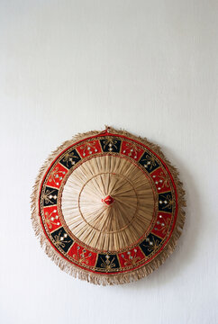 Decorative Phulam Jaapi Assamese Hat Hanging on White Wall